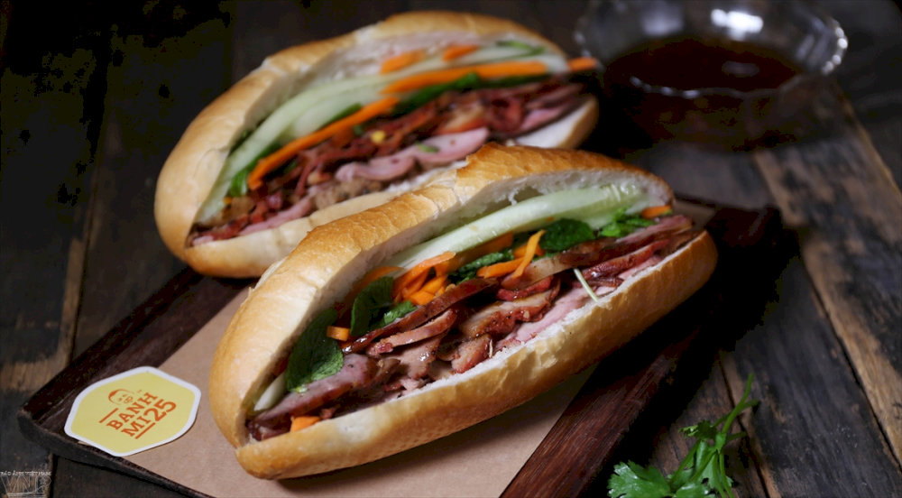 Bánh Mì 25 is a must-visit street food spot in Hanoi, known for its fresh, crispy rolls and a wide range of fillings from classic pork to vegan options